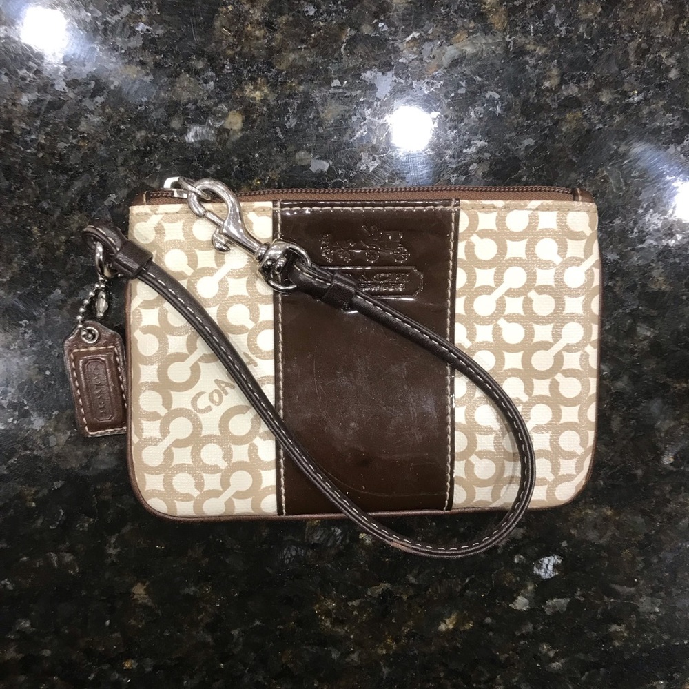 Coach wristlet with leather details